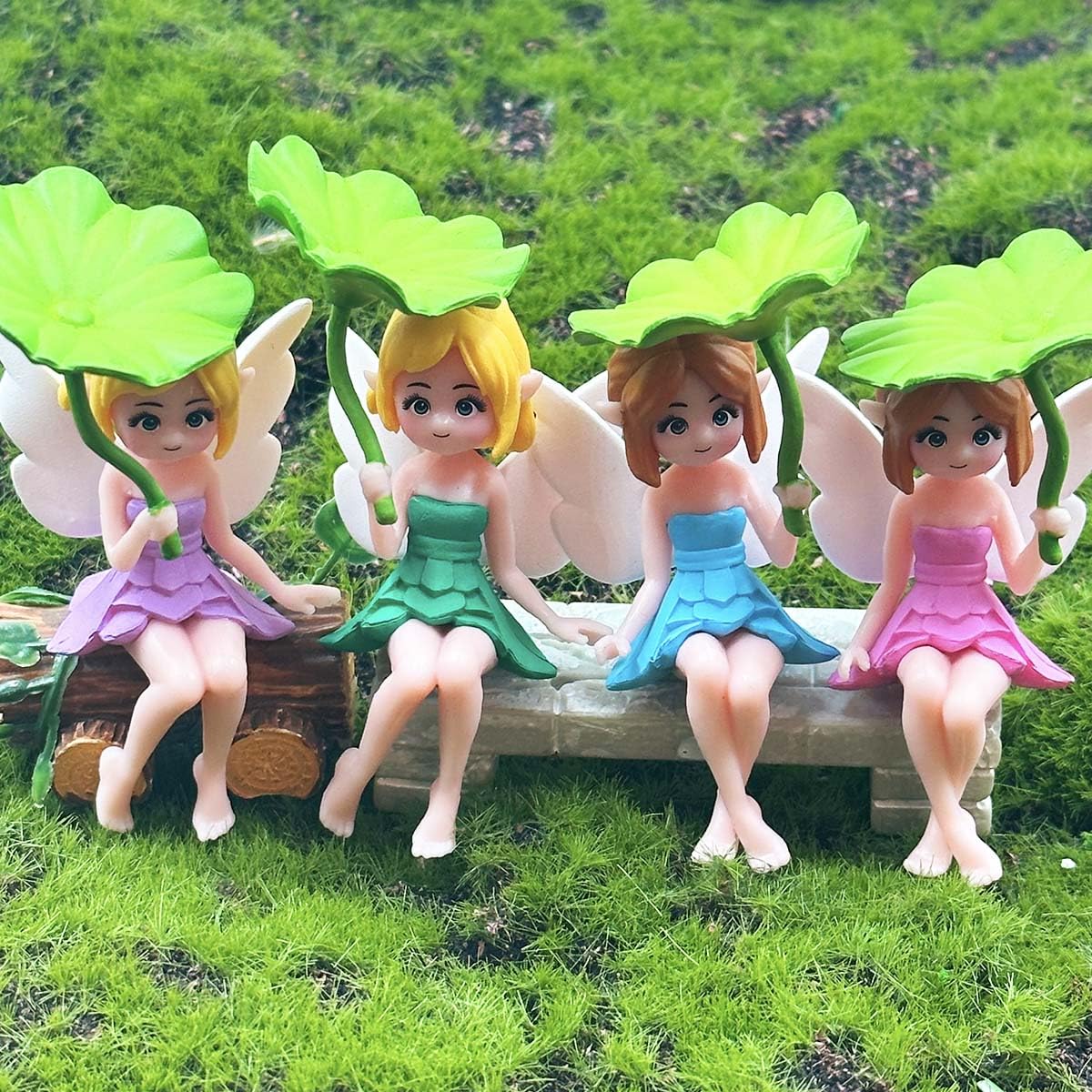Suartus miniature fairies decorate moss landscapes and terrariums with subtle color