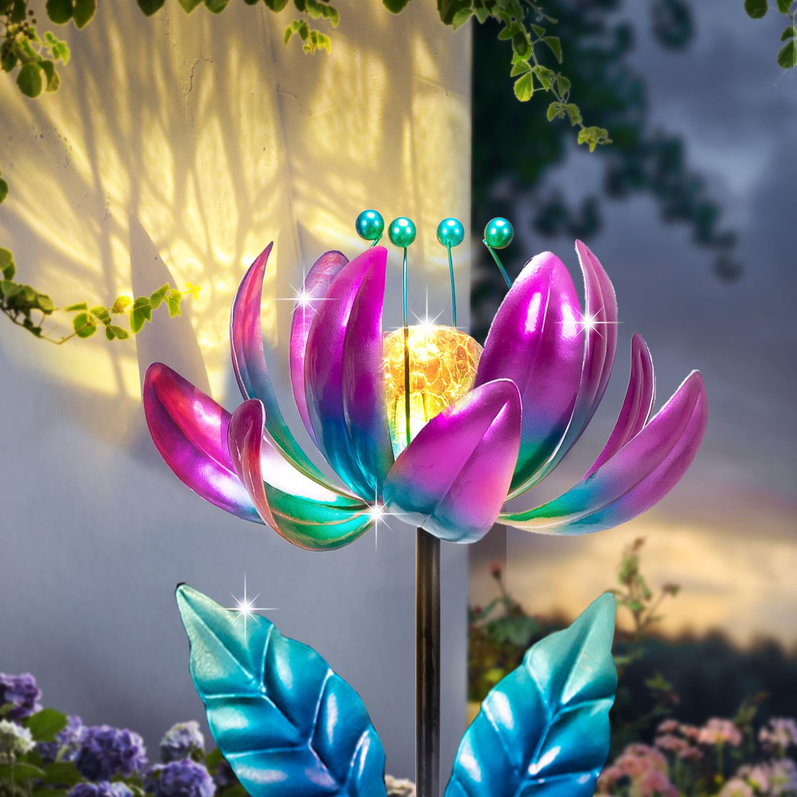 SUCUY lotus solar wind spinner center in motion for dynamic garden art.