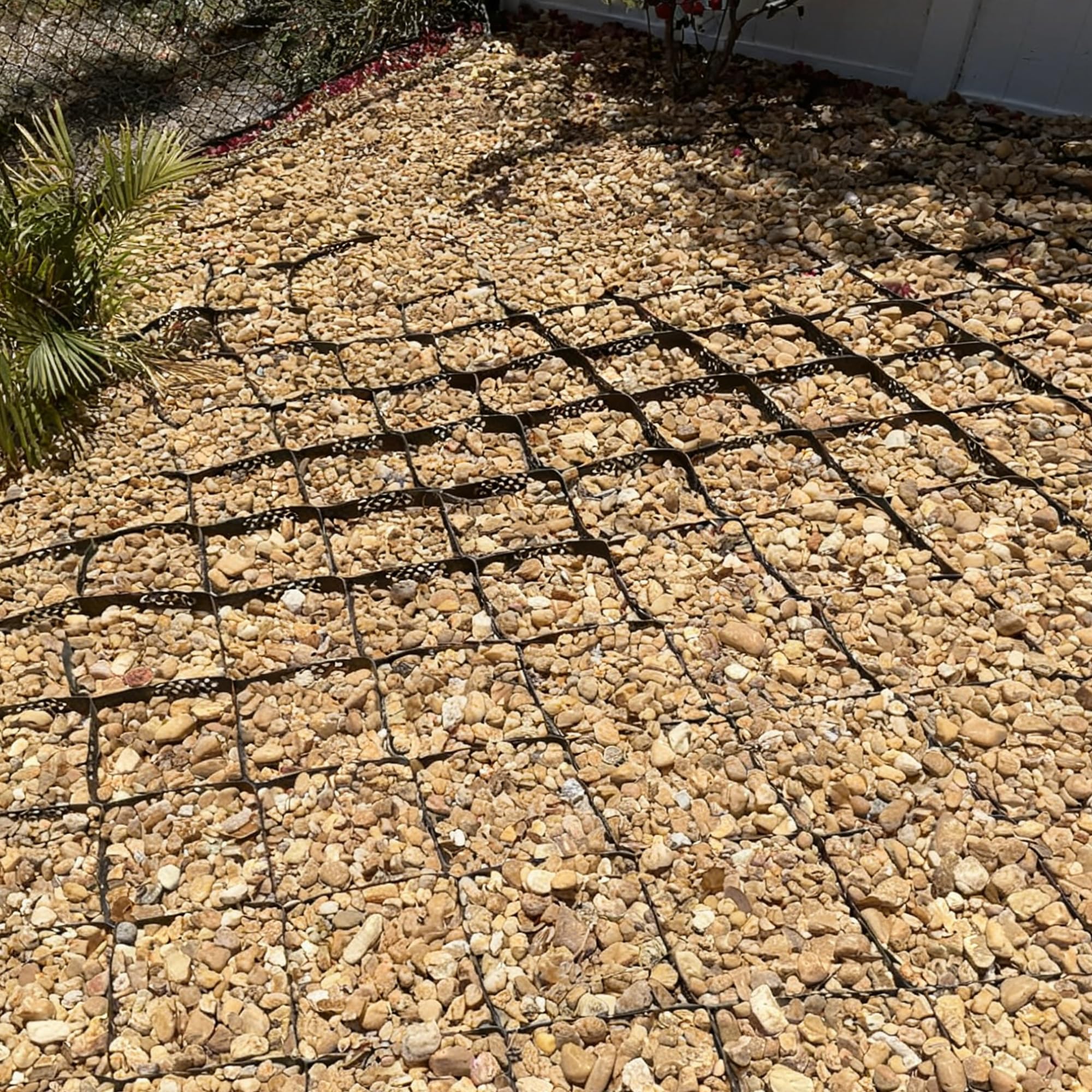 Sumloty Gravel Grid near a garden shows easy expansion and customization