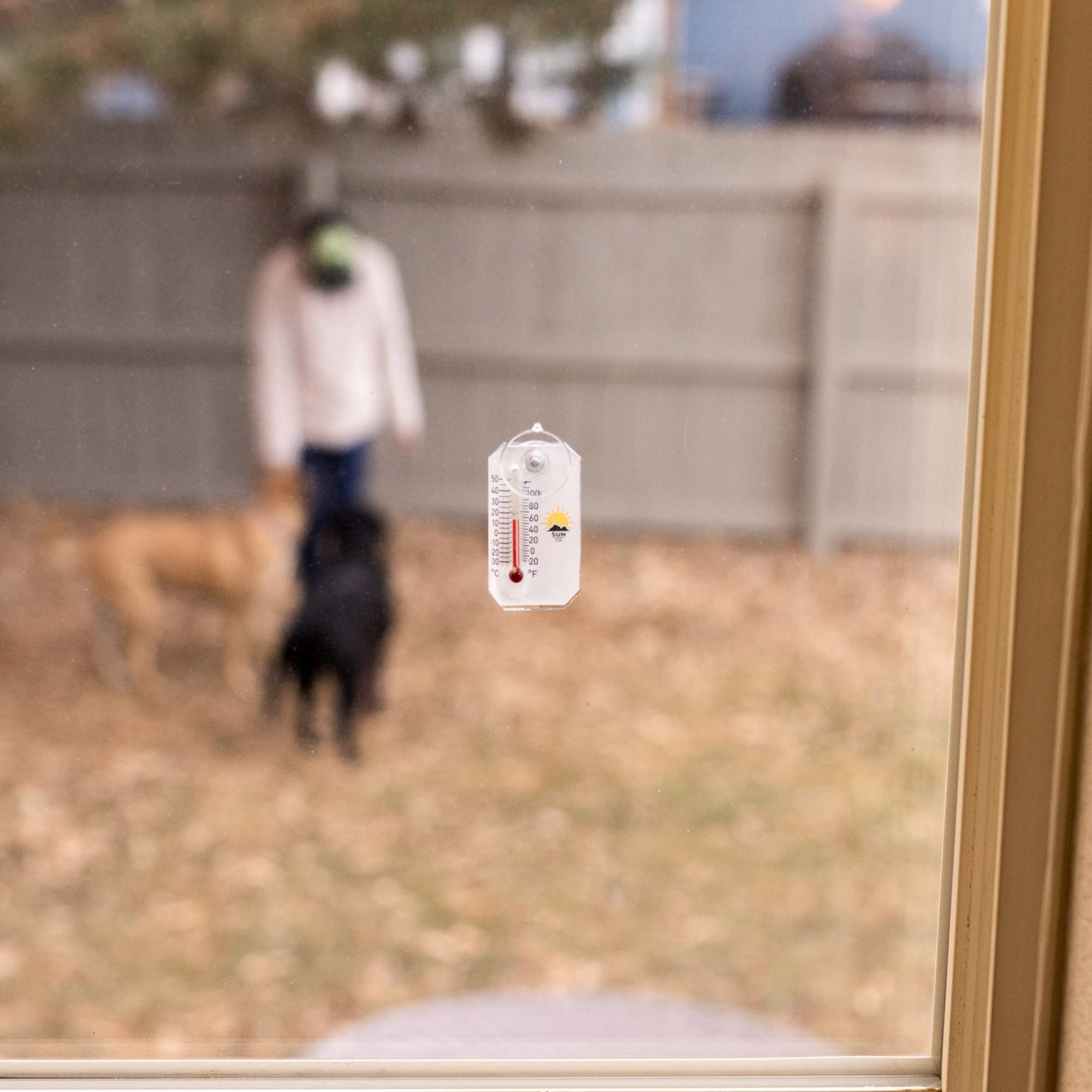 Sun Company Stickler compact 2.1-inch thermometer on a window.