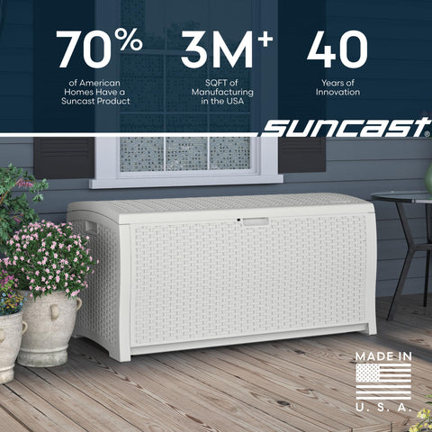 Suncast 99-gallon deck box in a backyard setup for organized storage