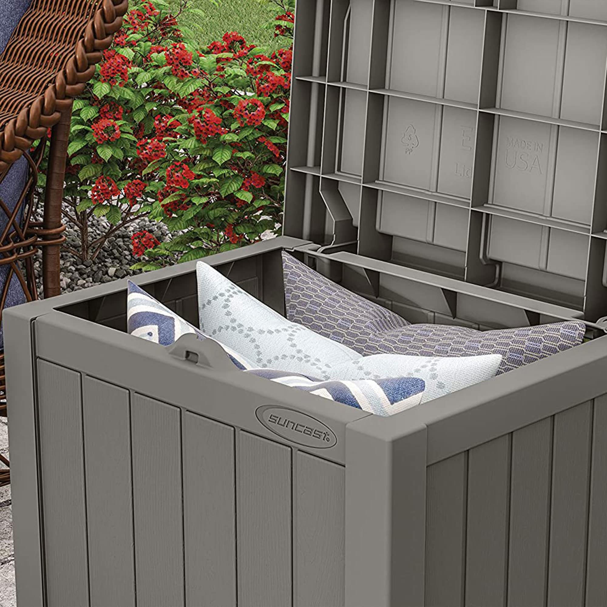 Suncast storage box storing cushions and towels neatly