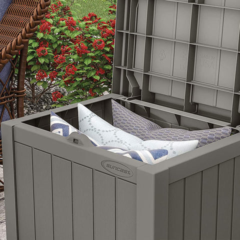 Suncast storage box storing cushions and towels neatly