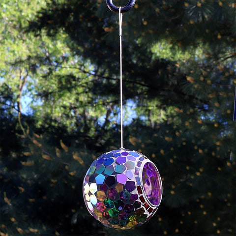 Sunnydaze Garden scene with feeder showcases vibrant patio decor and wildlife enjoyment.