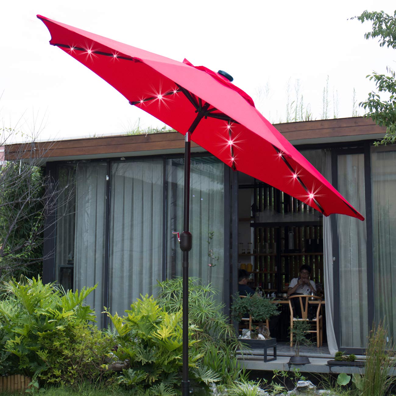 Sunnyglade 9' solar LED umbrella patio scene showcasing all-weather shade.