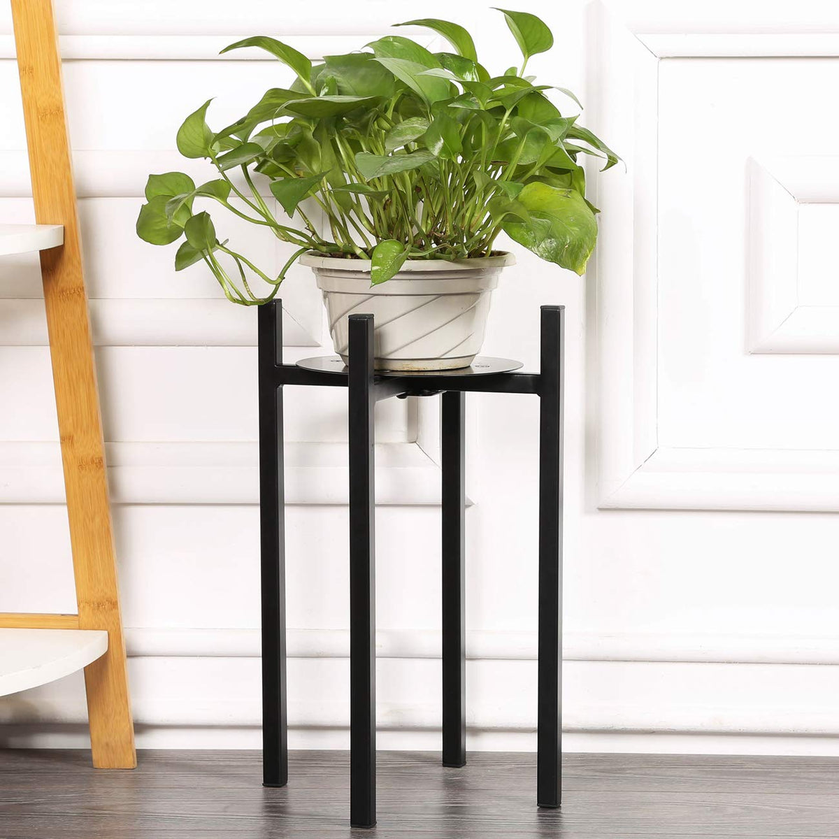 Sunnyglade plant stand with metal base and legs for stable indoor support.