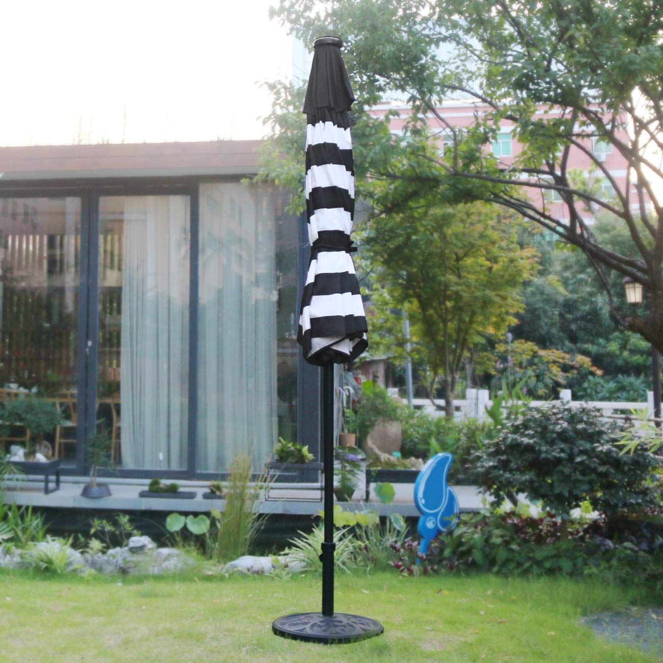 Sunnyglade 9-foot diameter umbrella shading a 48-inch table.
