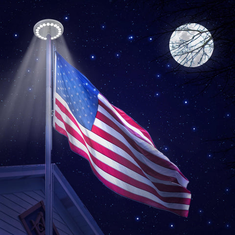 Sunnytech solar flag light at night illuminates flag for visibility