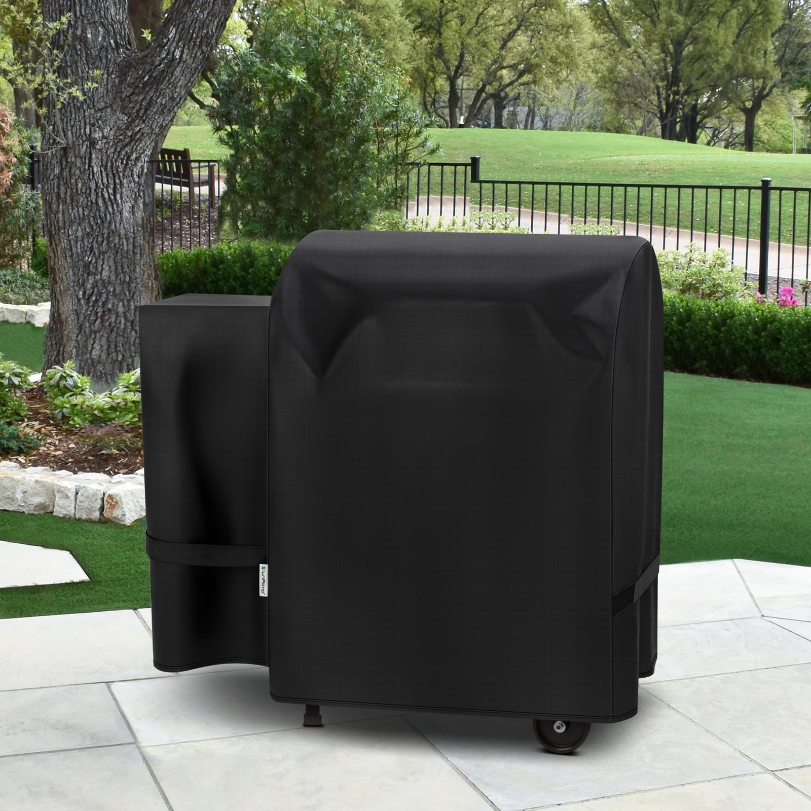 SunPatio Easy-clean outdoor cover being rinsed after a cookout.