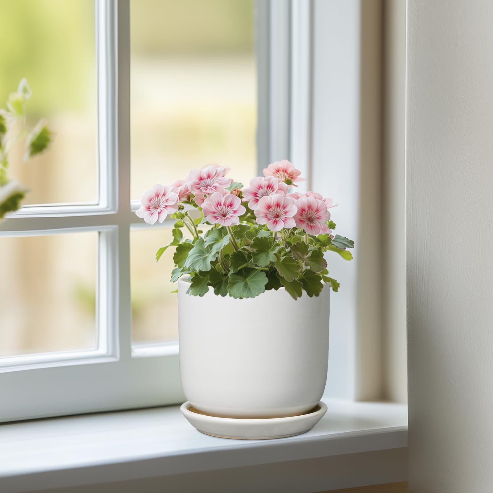 SUNPOTFOR round white planter showing drainage hole design for tidy watering.