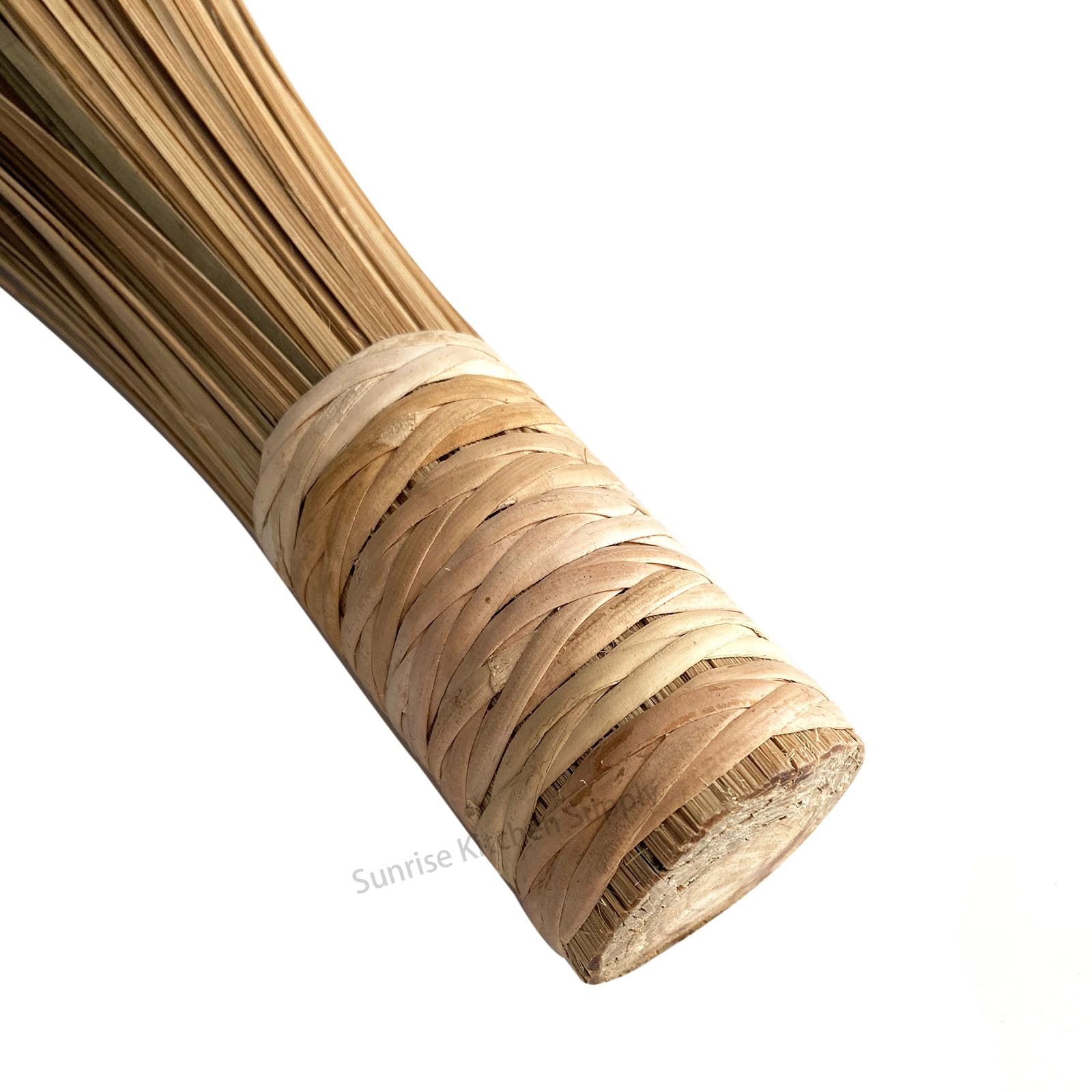 SUNRISE Bamboo Wok Brush stored upright for easy access in kitchen.