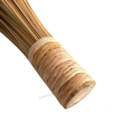 SUNRISE Bamboo Wok Brush stored upright for easy access in kitchen.