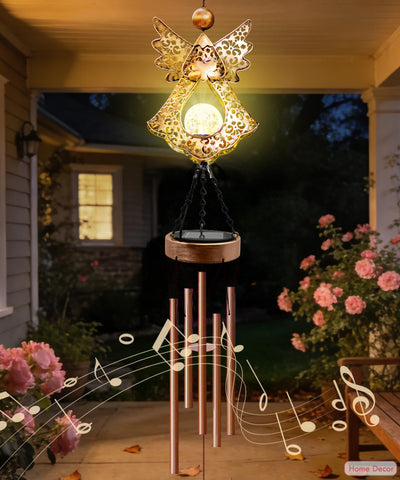 Supdeco Solar Angel Wind Chime in garden setting adds a soothing soundscape.