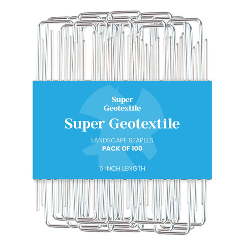 Super Geotextile sod-staple securing weed barrier on soil.