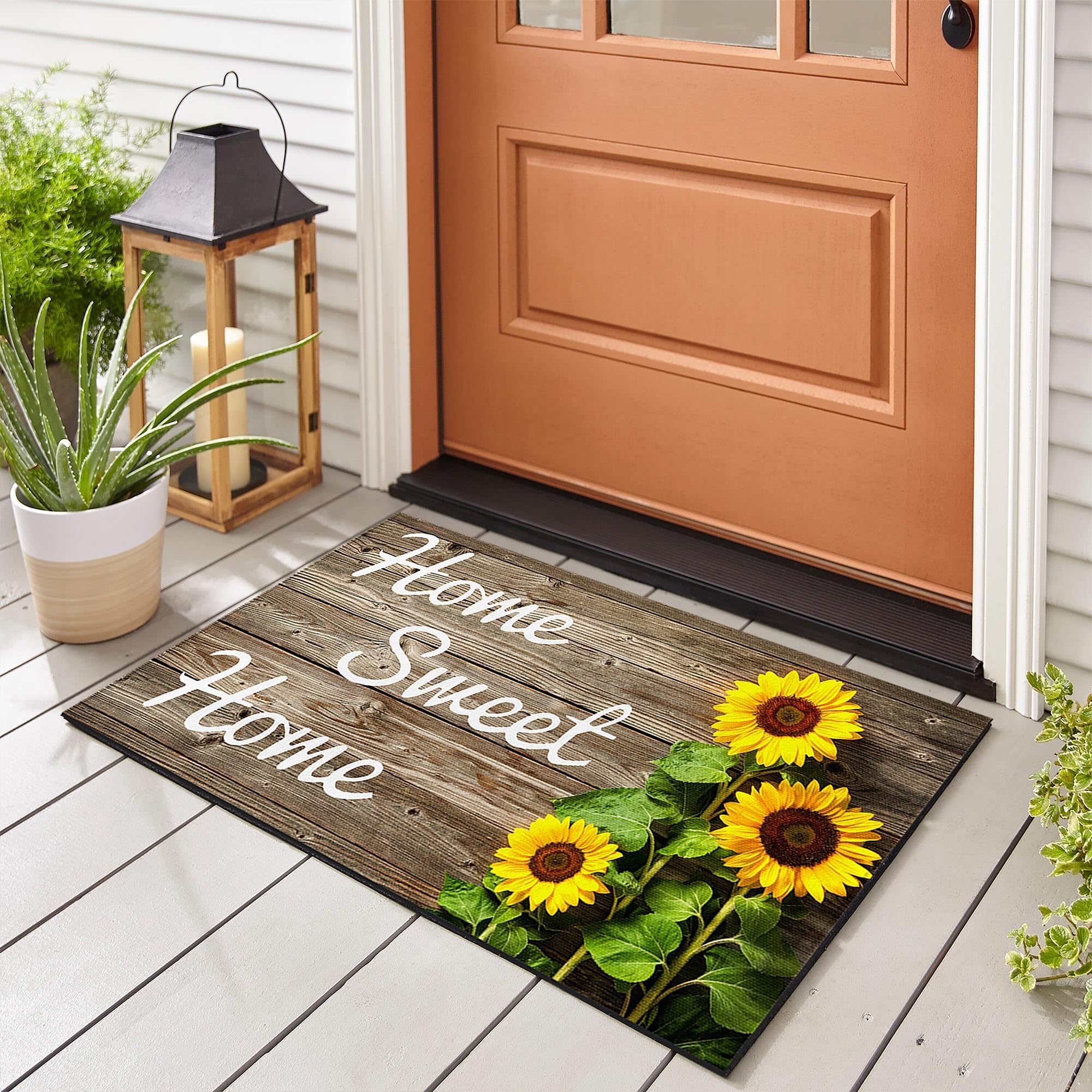 SuQKXCo Sunflower Welcome Doormat on wood background; soft touch and inviting curb appeal