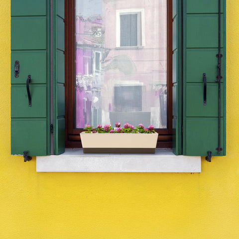 Suream window box attached saucers catch extra water and protect surfaces.