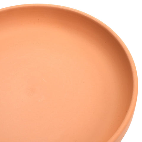 Suwimut terracotta saucer texture is porous for moisture balance.