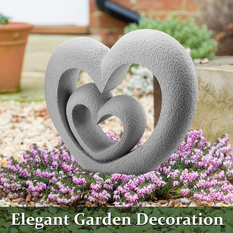Suzile Nesting Heart Garden Statue placed in garden, serves as a subtle memorial focal point.