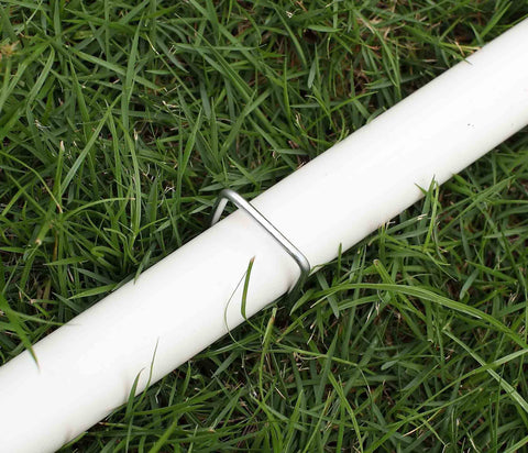 Sweecomb bird netting and edging secured with galvanized stakes.
