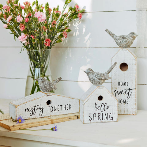 Three-piece Synovana set displayed on a mantel creates a cozy welcome.