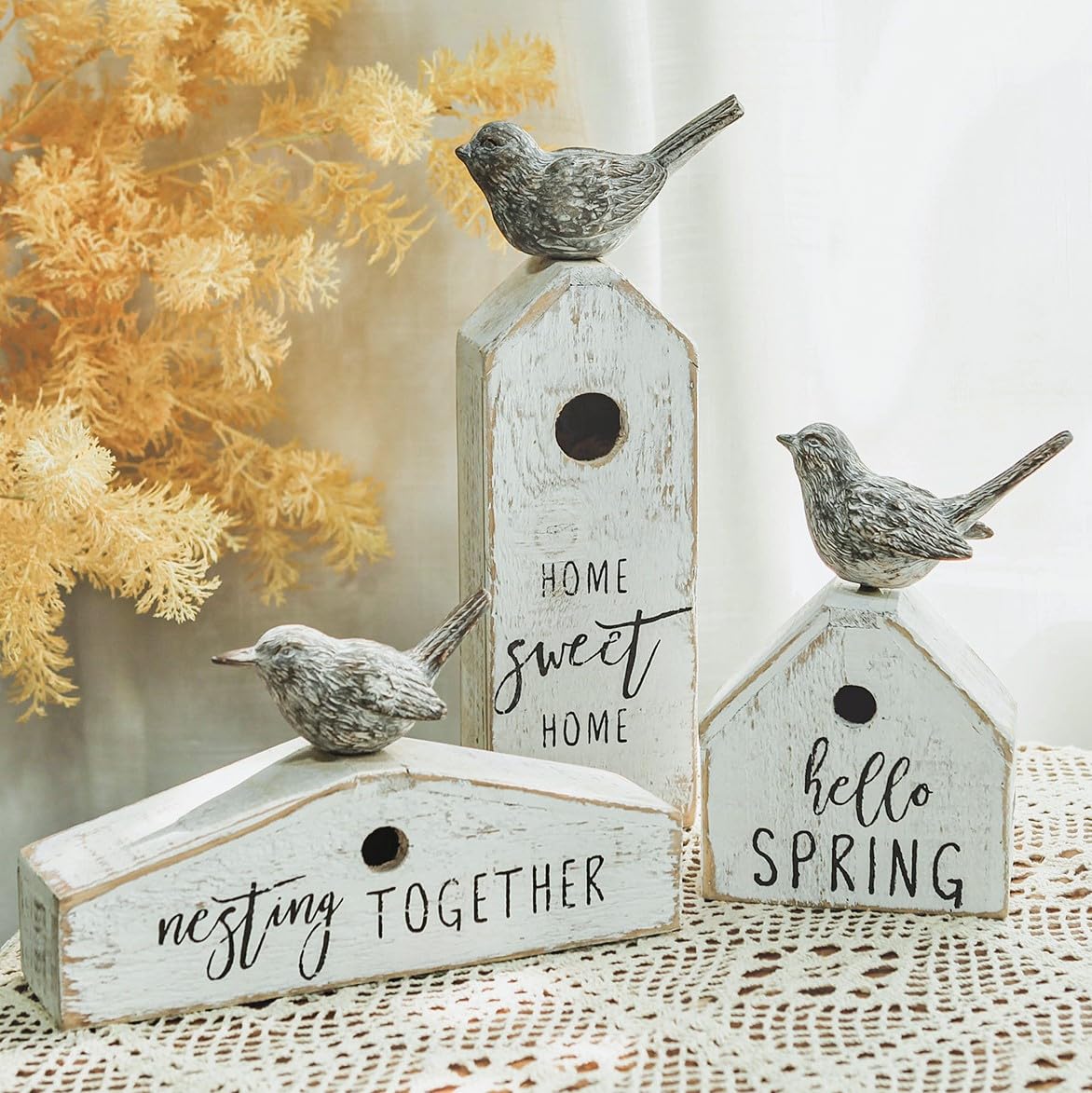 Synovana birdhouse decor with distressed whitewash adds rustic shelf charm.