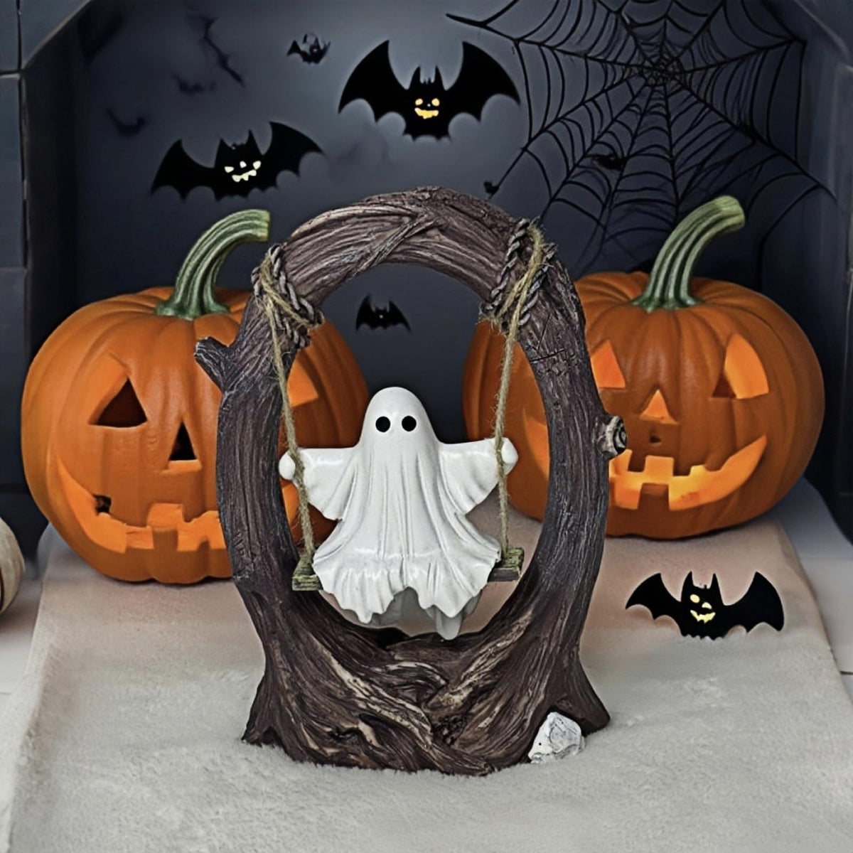 T Starlight Bright Q swinging ghost on a rustic tree swing elevates shelves and displays.