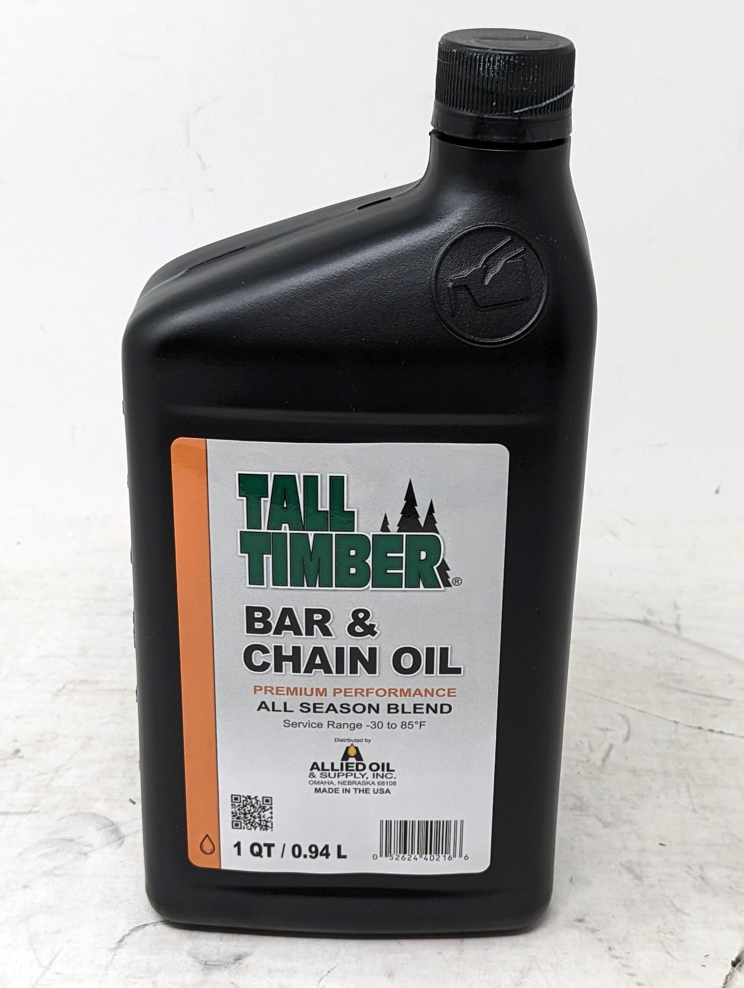 Tall Timber Bar and Chain Oil can label highlights rust protection and low-temperature performance.