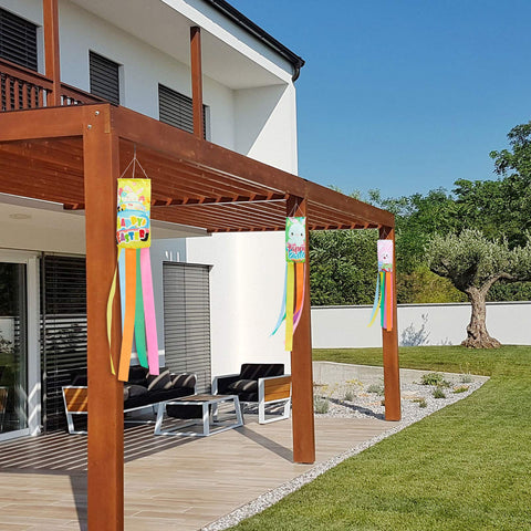 Tatuo Easter windsock car pattern flag creates lively display along yard path.