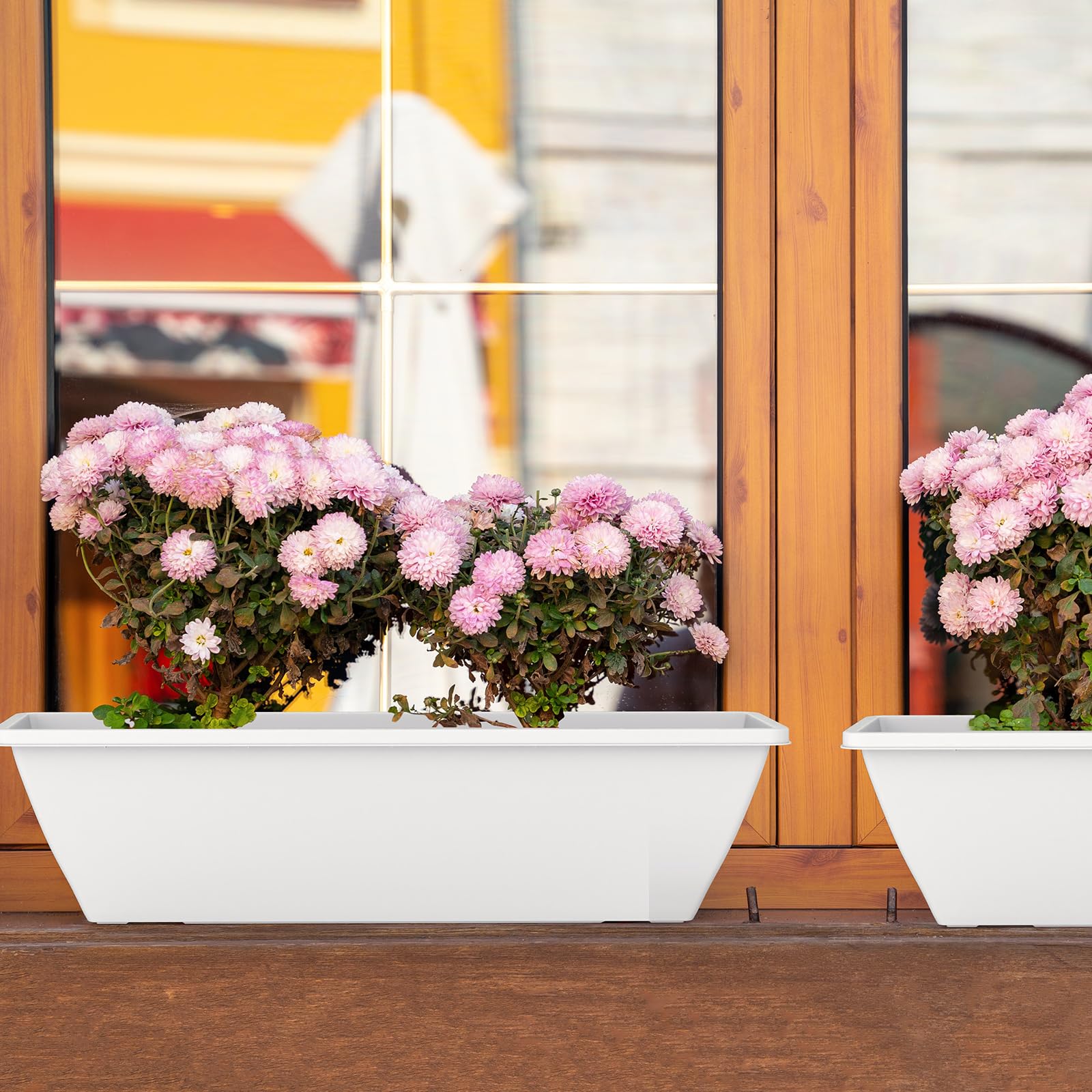 Tcevily durable plastic window planter box suitable for outdoor use.