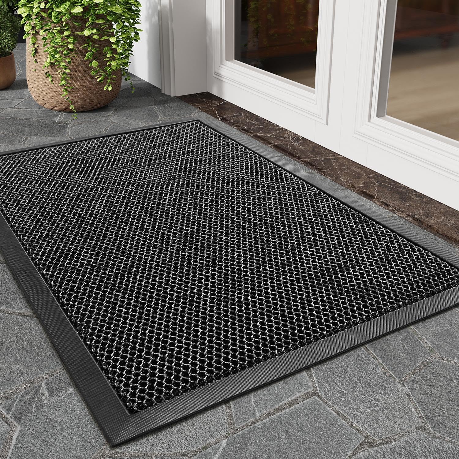 Tchdio dirt-trapper mat close-up shows mesh for debris capture and entry protection.