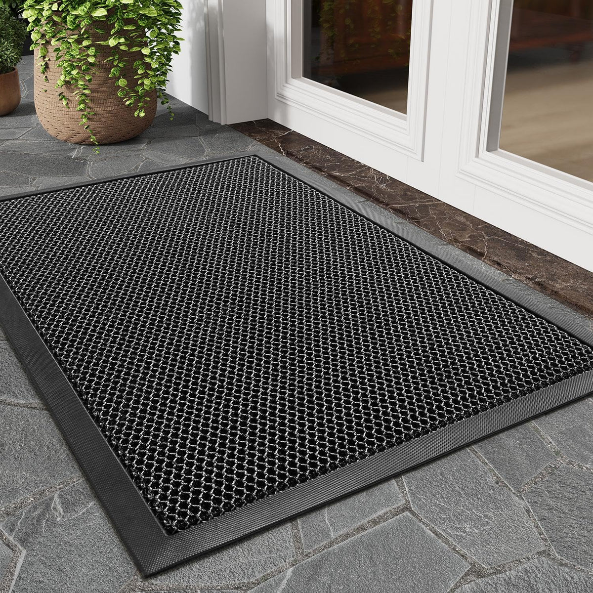 Tchdio dirt-trapper mat close-up shows mesh for debris capture and entry protection.