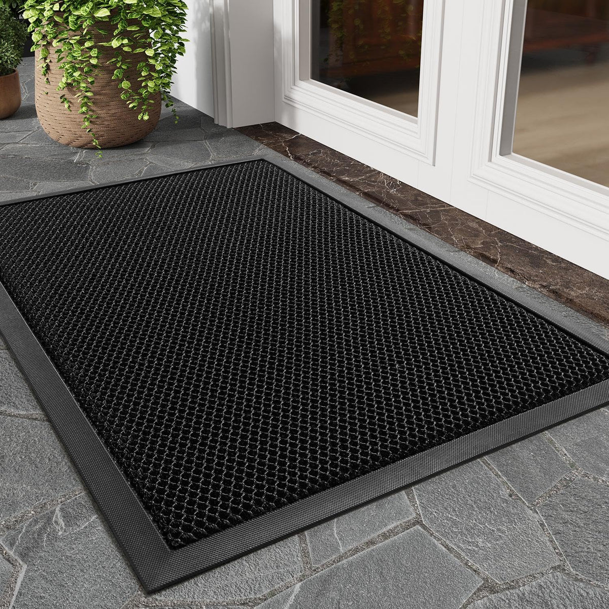 tchdio dirt-trapping front door mat with mesh surface to keep entryways cleaner.