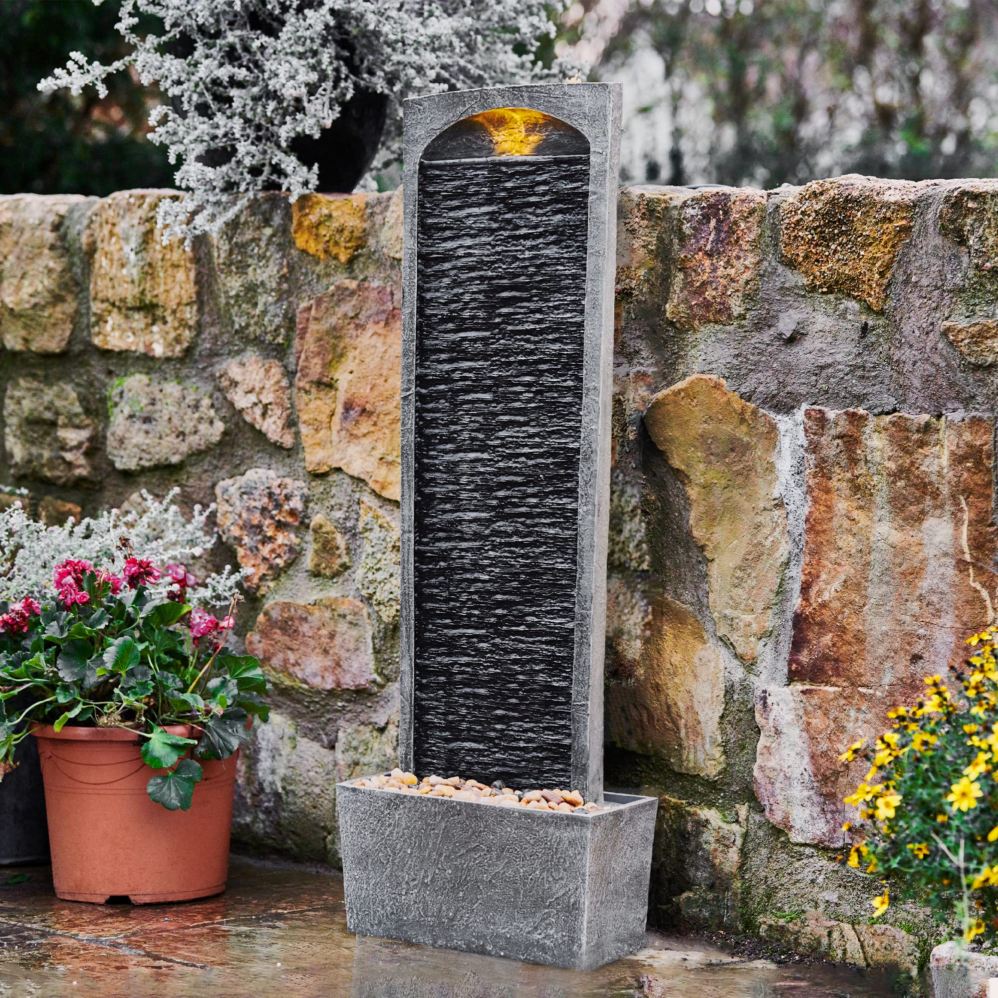 Teamson Home textured slate-inspired facade blends with decks and gardens.