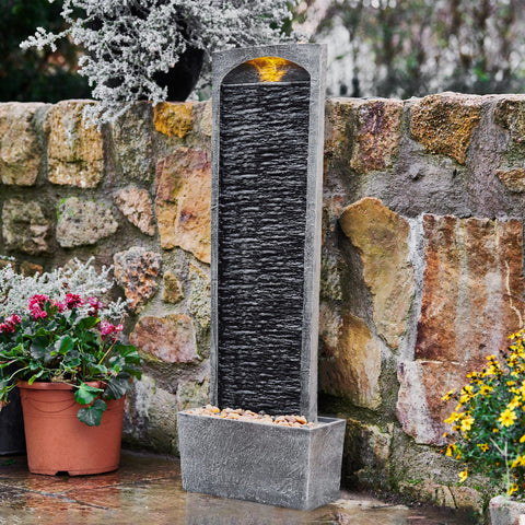 Teamson Home textured slate-inspired facade blends with decks and gardens.