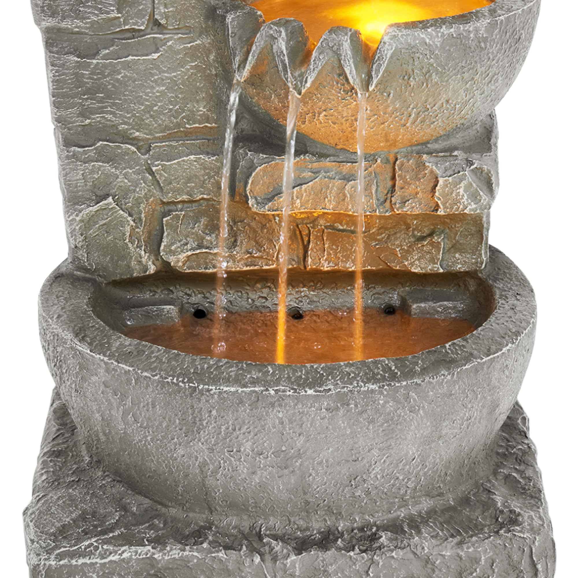 Teamson Home lawn-friendly fountain blends with garden rocks for a natural look.