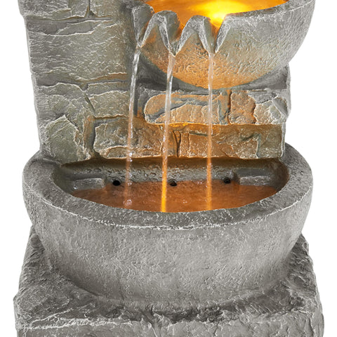 Teamson Home lawn-friendly fountain blends with garden rocks for a natural look.