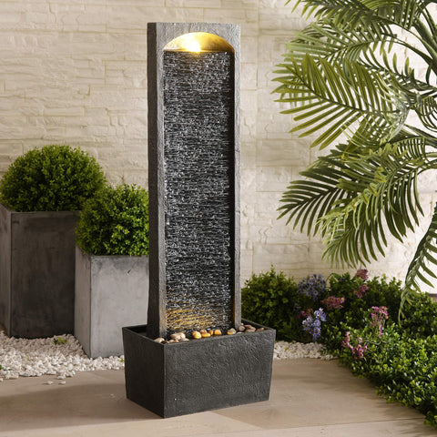 Teamson Home pebble base waterfall delivering soothing outdoor sound on patios.