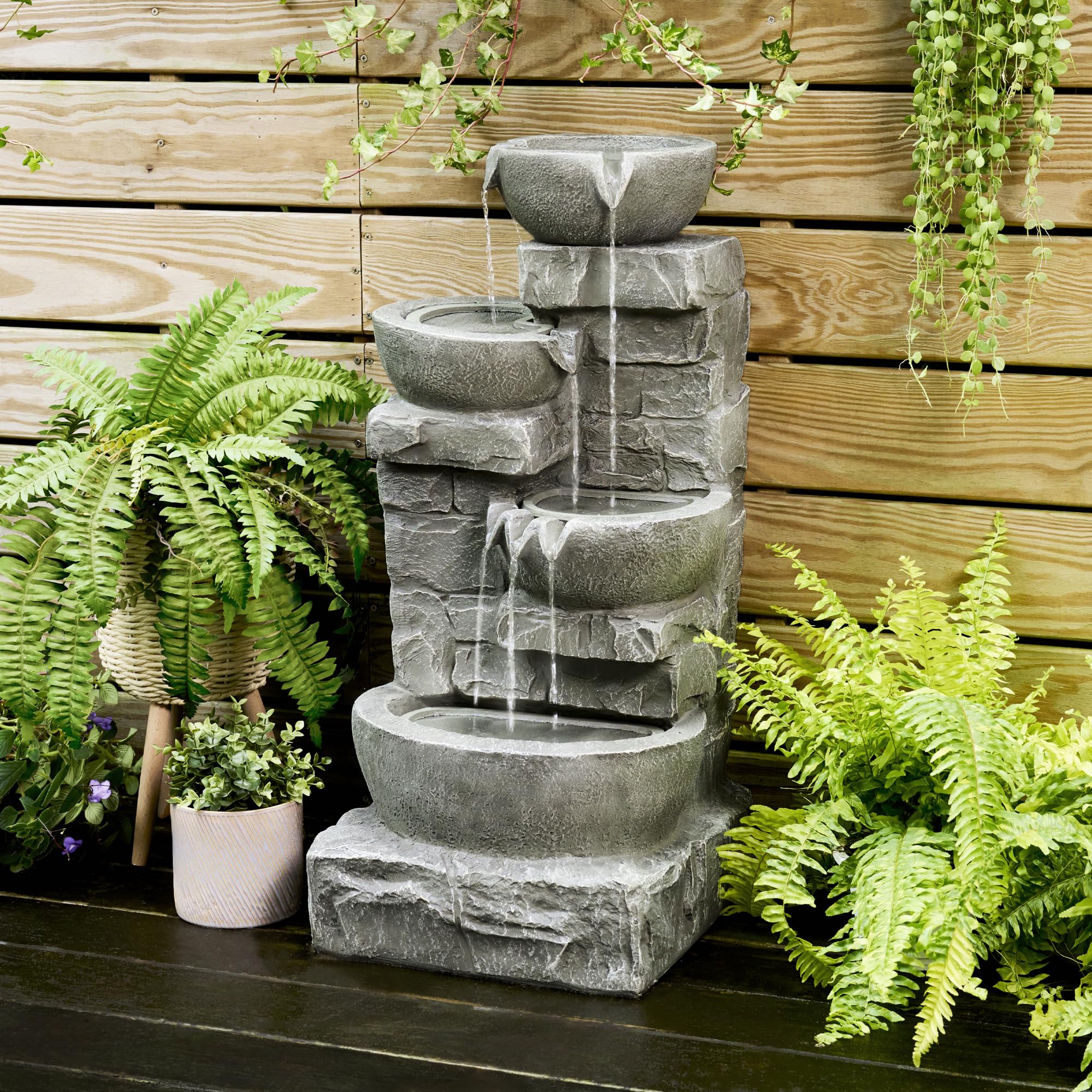 Teamson Home stacked stones fountain with LED lights for ambient evening viewing.