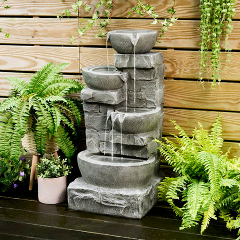 Teamson Home stacked stones fountain with LED lights for ambient evening viewing.