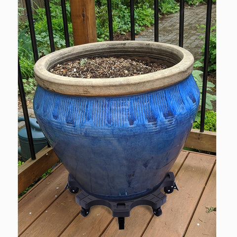 Techyang rolling stand with 9 wheels supports large planters effortlessly.