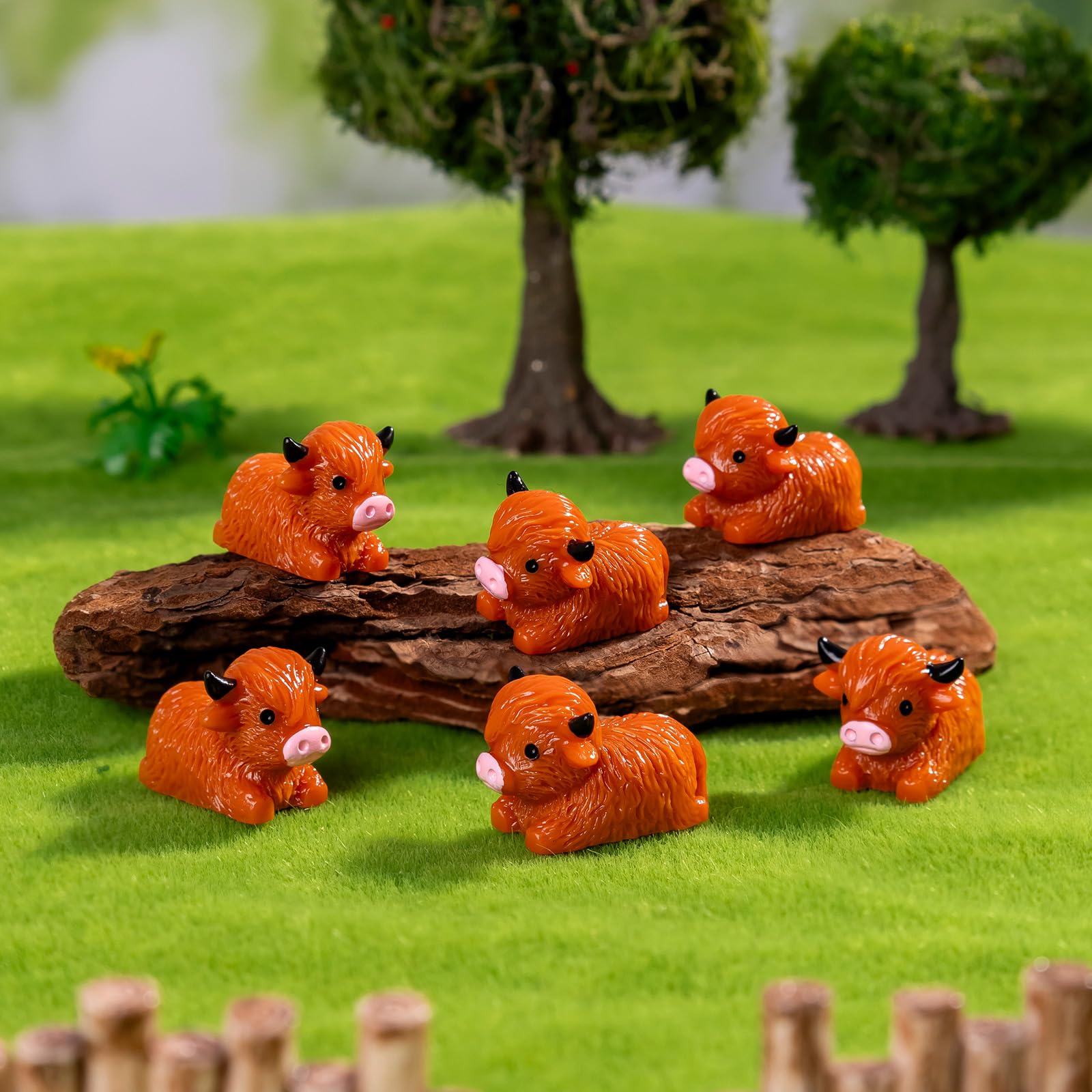 Teenzee-garden-miniature-highland-cow-ornaments bring whimsy to outdoor spaces.