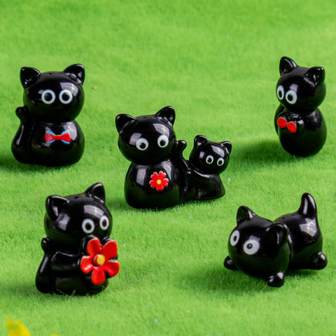 Teenzee glossy black cat figures for indoor decor and crafts.