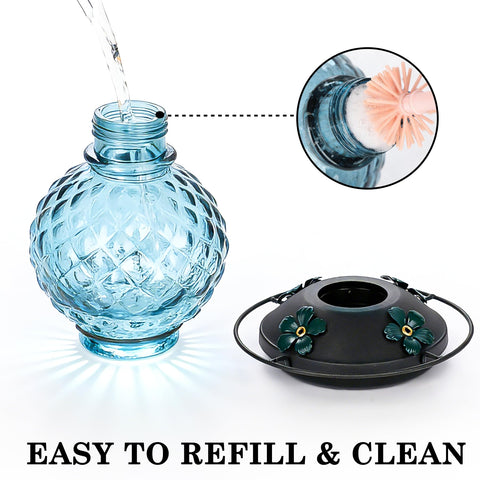 Tegarbed glass hummingbird feeder with built-in ant moat to deter insects