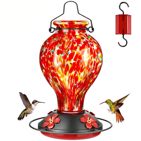 Tegarbed hummingbird feeder with red polka dots attracts garden birds.
