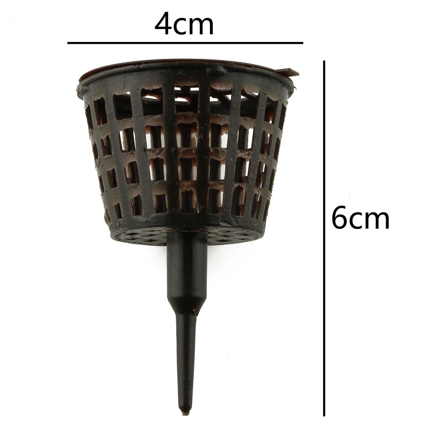 Tegg fertilizer basket inserted in soil during watering for targeted feeding