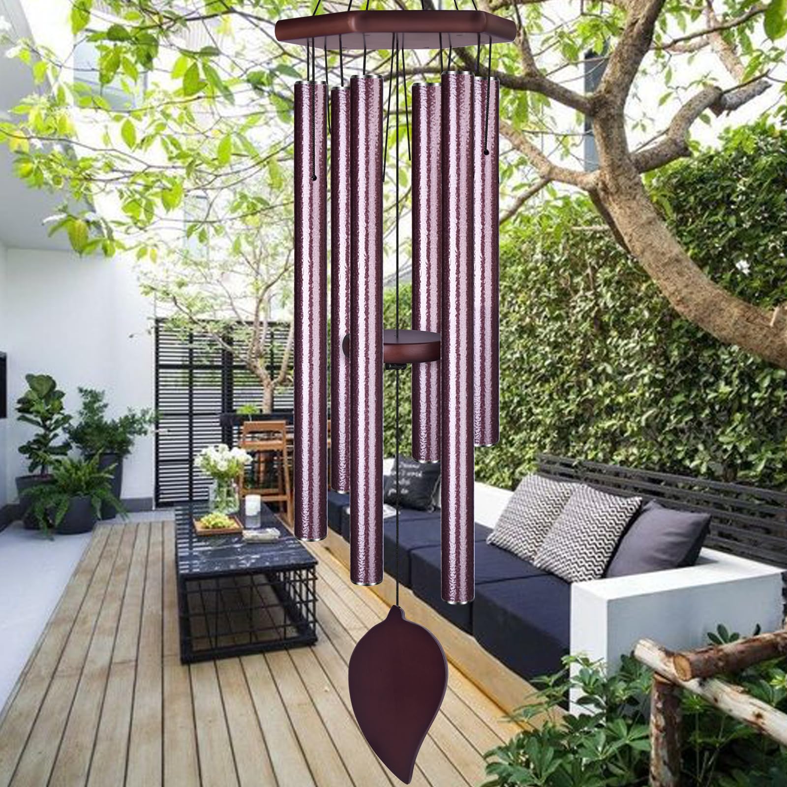 TESECU Sympathy Wind Chimes outside in a garden for deep-toned ambience.
