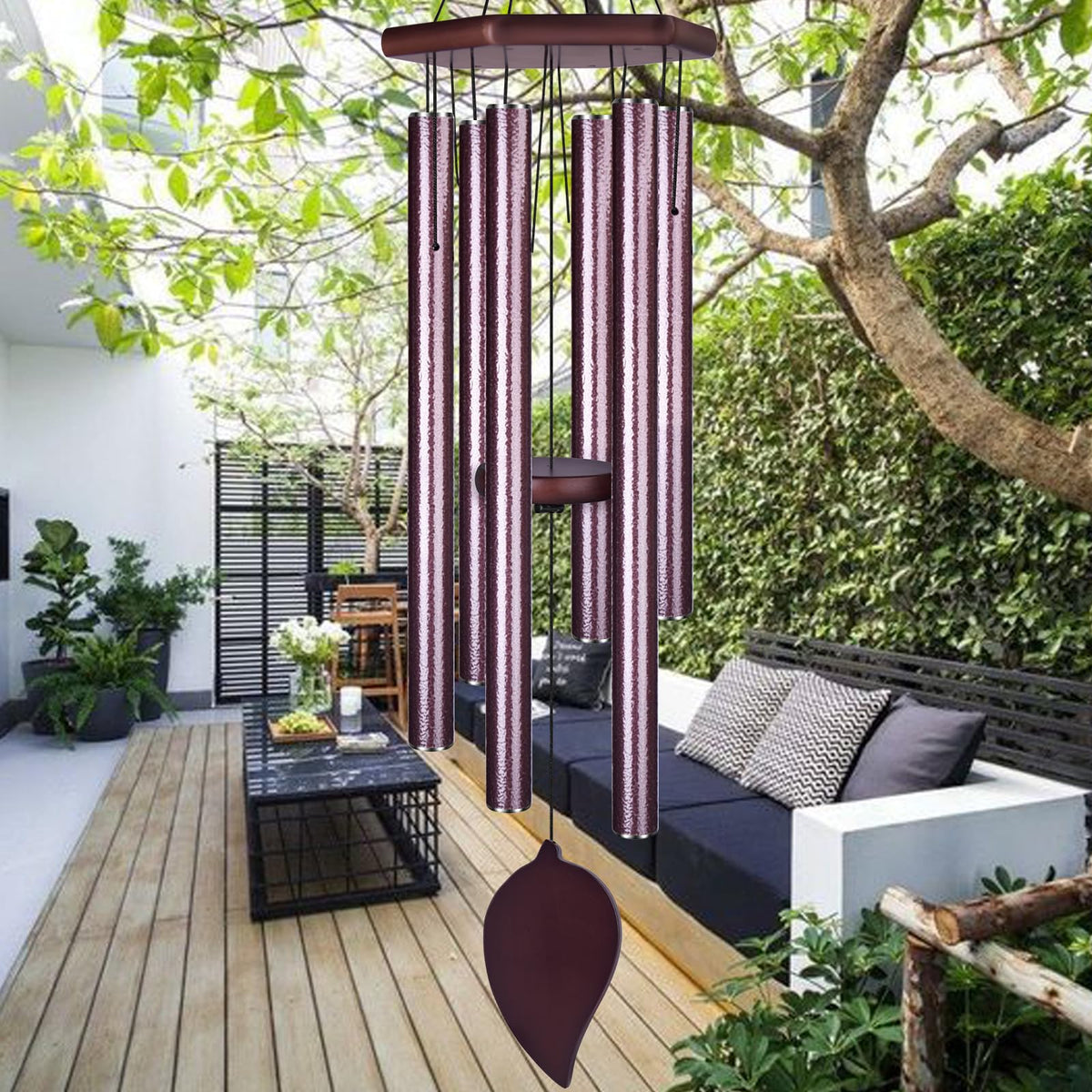 TESECU Sympathy Wind Chimes outside in a garden for deep-toned ambience.