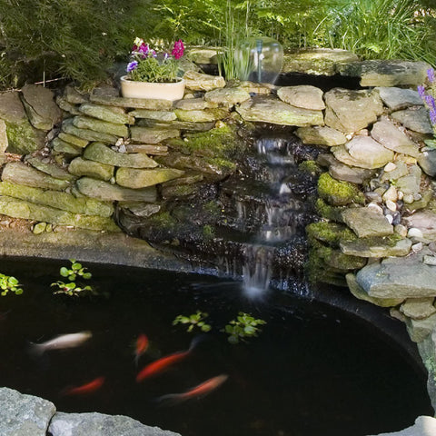 Ornamental fountain with Tetra Pond Fountain Block ready for maintenance.