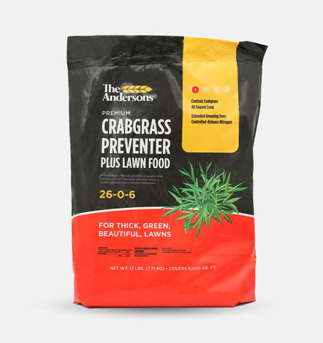 The Andersons crabgrass preventer plus fertilizer bottle ready for lawn care.