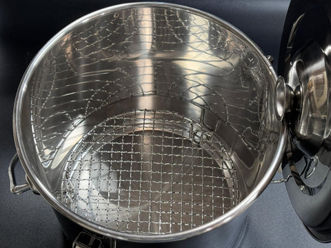 The Bincho Grill Charcoal Saver folding handle enables safe, easy transport.